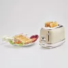 Tostadora Ariete 155 Design de 2 ranuras con cestillos para sándwich, 6 niveles de tostado, 810 W, carcasa de acero inoxidable, bandeja recogemigas extraíble, beige pastel