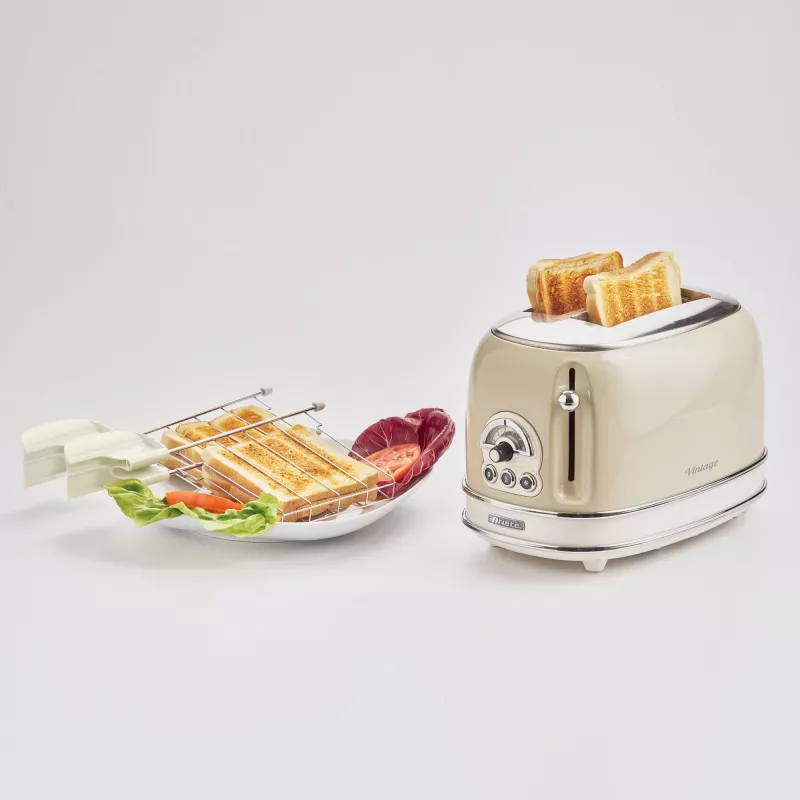 Tostadora Ariete 155 Design de 2 ranuras con cestillos para sándwich, 6 niveles de tostado, 810 W, carcasa de acero inoxidable, bandeja recogemigas extraíble, beige pastel