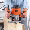 Fresadora Router/Trimmer Black & Decker KW1200EKA-QS — fresadora compacta con ajustes de profundidad regulables, diseño ergonómico