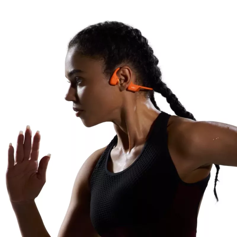 Auriculares de conducción ósea Shokz OpenRun Pro 2 — binaural, inalámbrico Bluetooth 5.3, IP55, 12 h de reproducción, 150 mAh, naranja, gancho de oreja