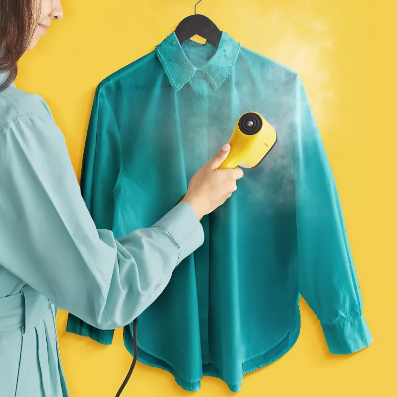 Plancha de vapor de mano Tefal DT2026 — depósito de agua de 0,07 l, 1300 W, amarillo