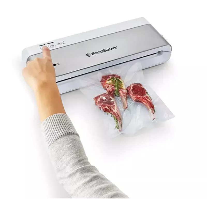 Envasadora al vacío FoodSaver VS0100X — dial giratorio, incluye rollo de film y 4 bolsas de vacío, blanco plateado