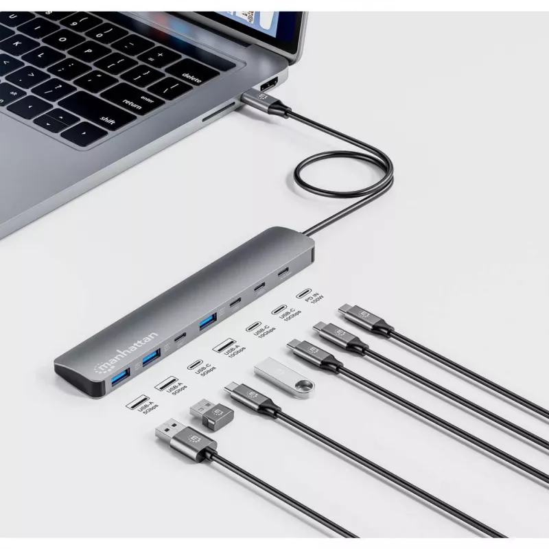 Manhattan dock/hub USB-C, puertos (x7): USB-A (x3) y USB-C (x4), con Power Delivery (PD) 100 W – requiere cargador USB-C externo (no incluido). Alimentado por USB (no requiere fuente de alimentación externa) cuando no se usa PD, aluminio