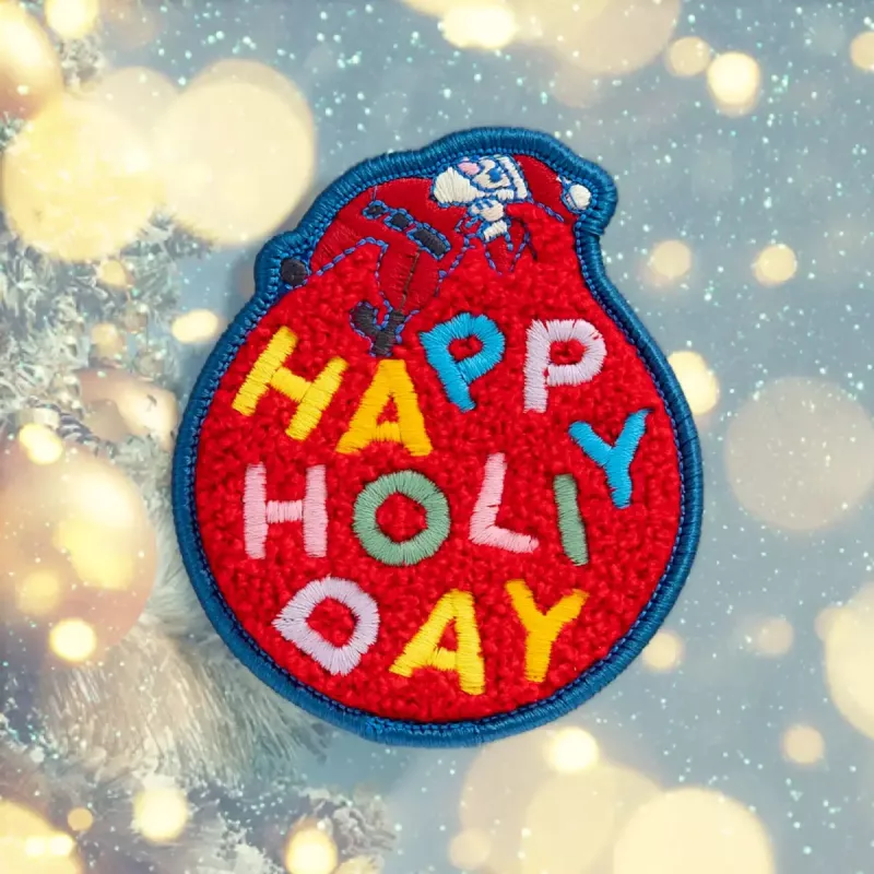 Insignia LAUT MAGMOJI BADGE – Happy Holiday Edition, tela, textil, rojo, 1 ud.