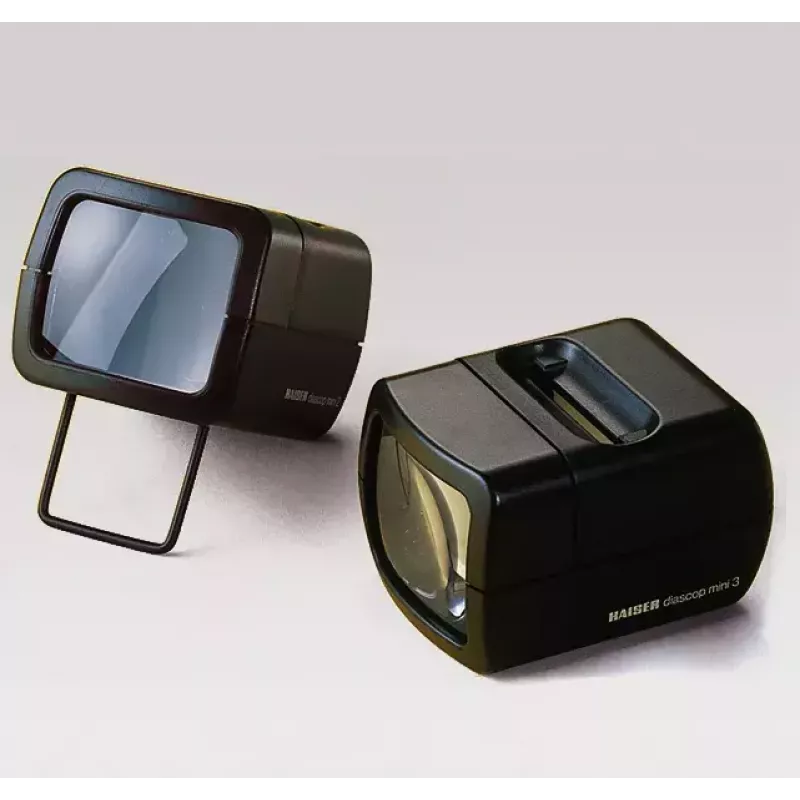 Proyector de diapositivas KAISER 2010 — compacto con aumento 3x, 75×105×60 mm, pila de 1,5 V