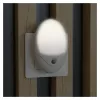 ENTAC Luz nocturna LED 0,5W ovalada blanco cálido con sensor crepuscular